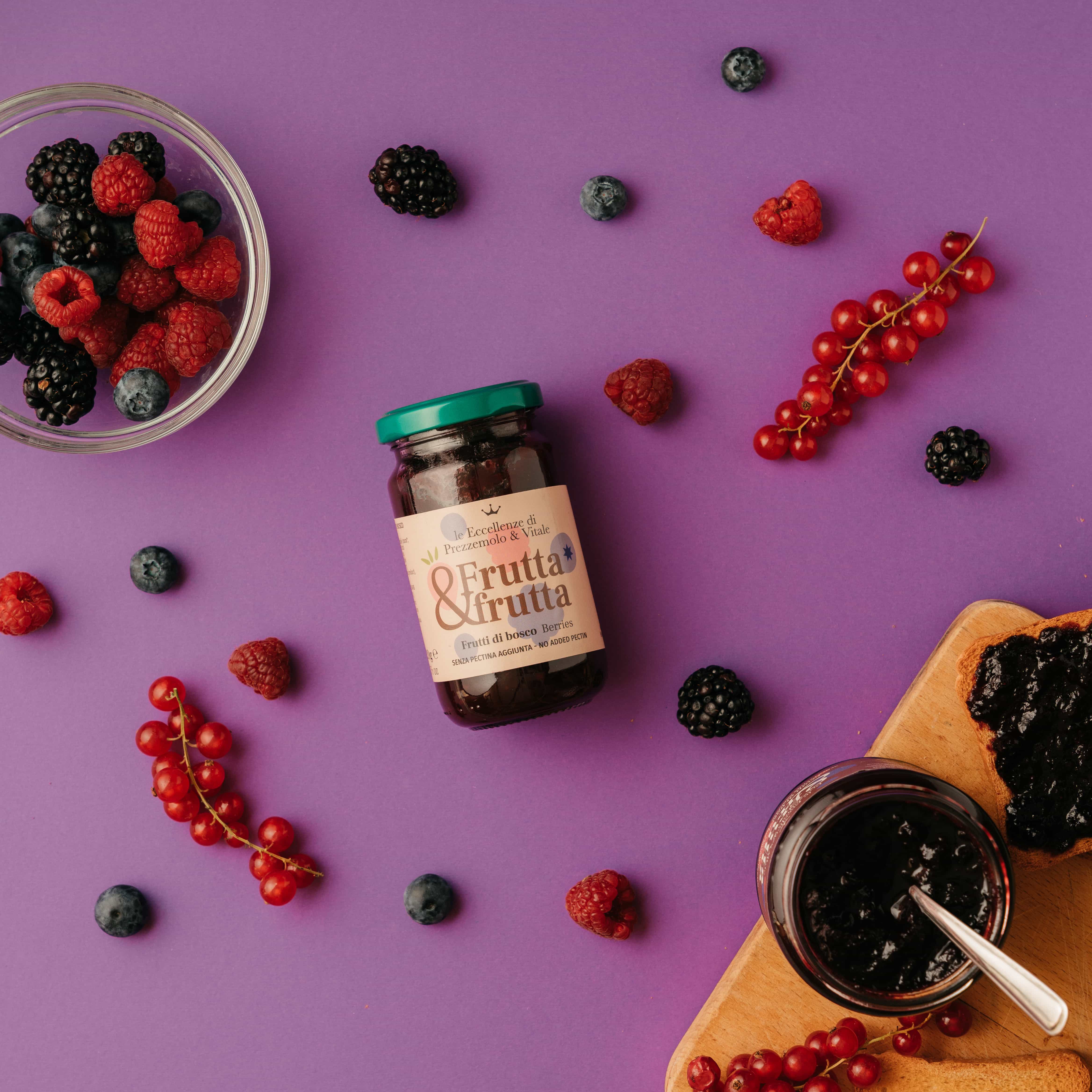 A top down photo of a berry jam with all the berrys on the table