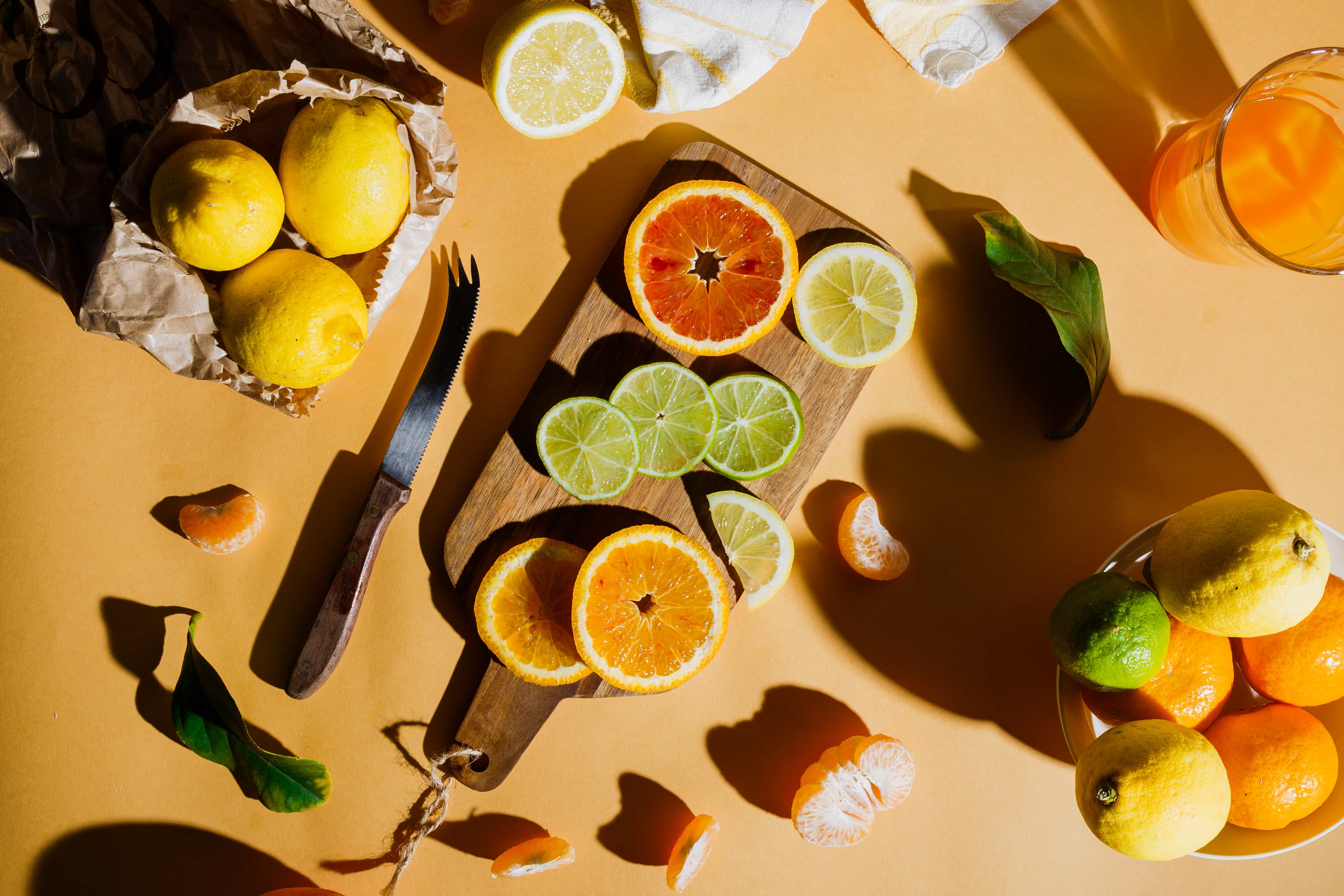 A top down photo of some cut fruits on a cutting board